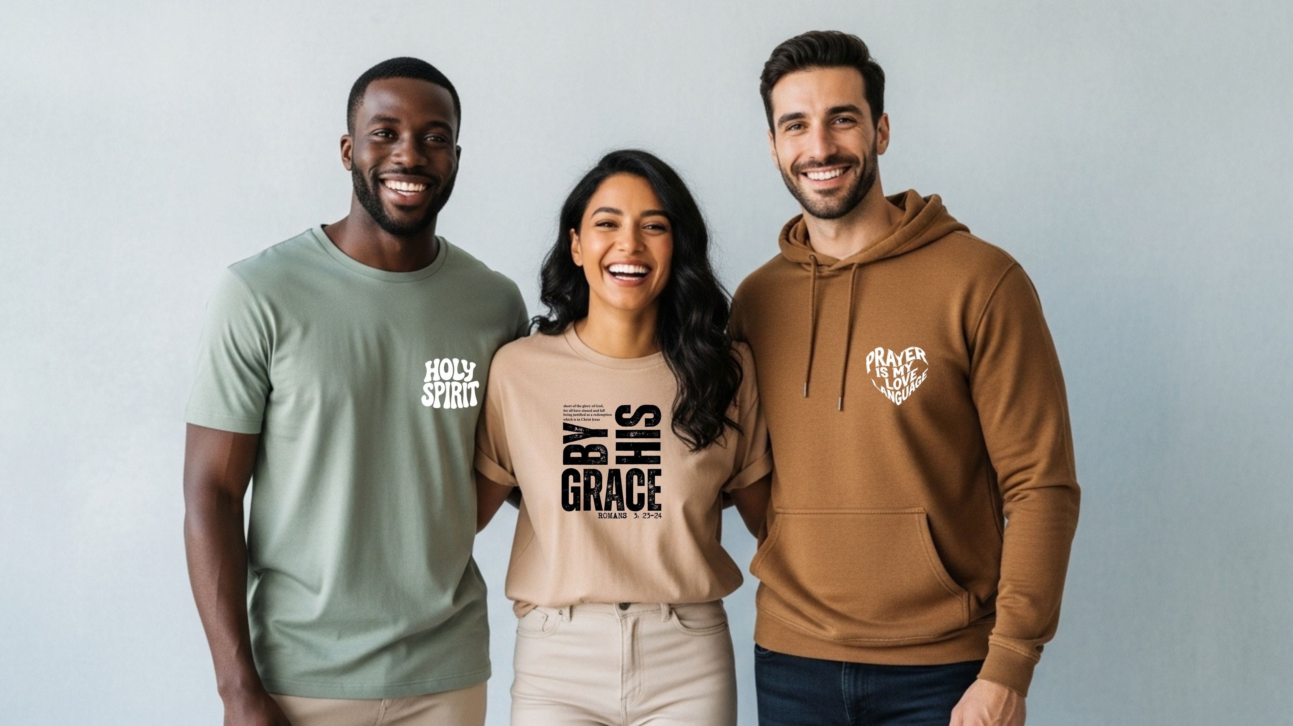 Three people wearing t-shirts with text, standing against a plain background
