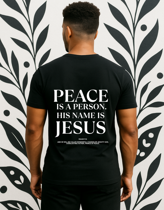 Faith-based men’s t-shirt reading “Peace Is a Person” in script; available in black (Midnight Prayer) and white (Pure Dawn), inspired by Psalm 126.